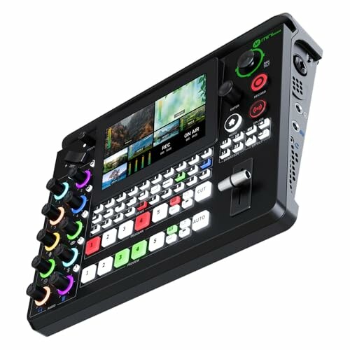 Audio video mixer console with screen and controls.