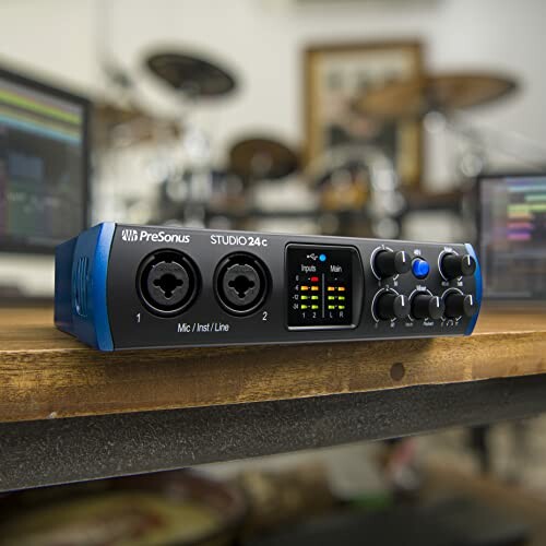 PreSonus Studio 24c audio interface on a wooden table